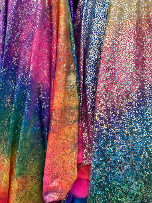 New Rainbow hologram metallic nylon spandex 4-way stretch rainbow fireworks and rainbow reptile snake hologram foil 58/60” Sold by the YD.