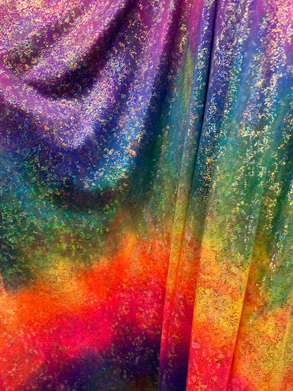 New Rainbow hologram metallic nylon spandex 4-way stretch rainbow fireworks and rainbow reptile snake hologram foil 58/60” Sold by the YD.