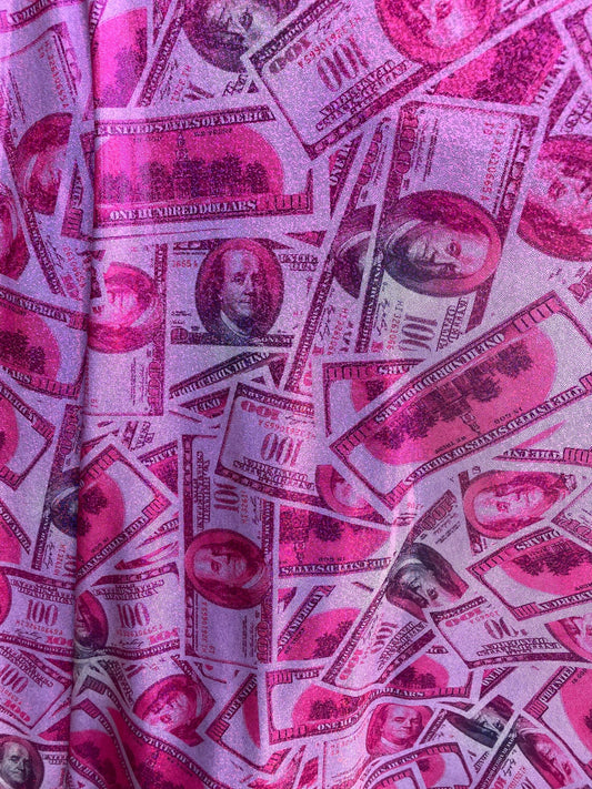 New metallic nylon spandex money design 100 dollar bill pink/green print on 4-way spandex with foggy foil all over 58/60” Sold by the YD.