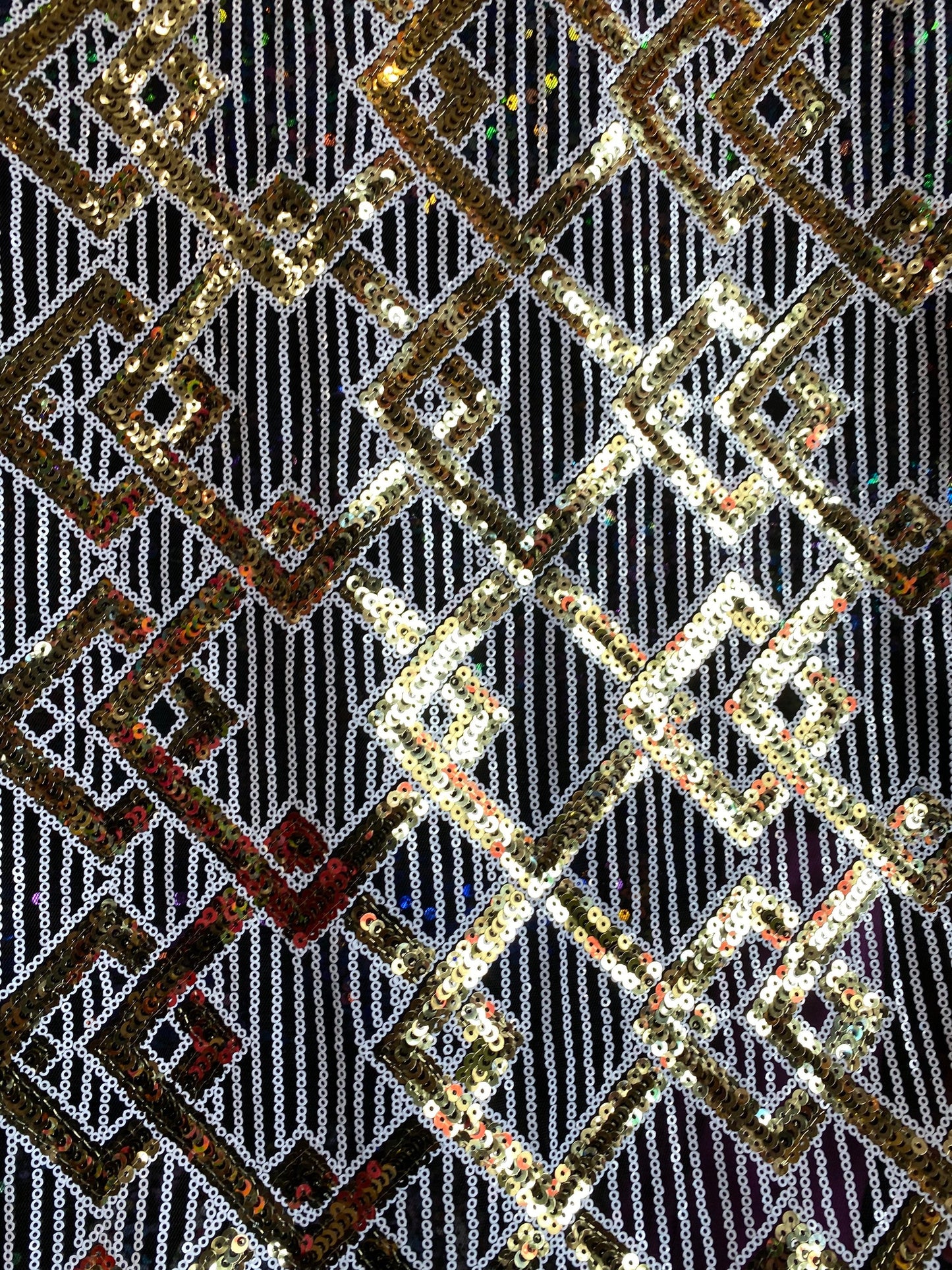 New geometric sequins Black/white/gold embroidered on stretch mesh 2-way 55/57” Sold by the YD. Ships Worldwide from Los Angeles California