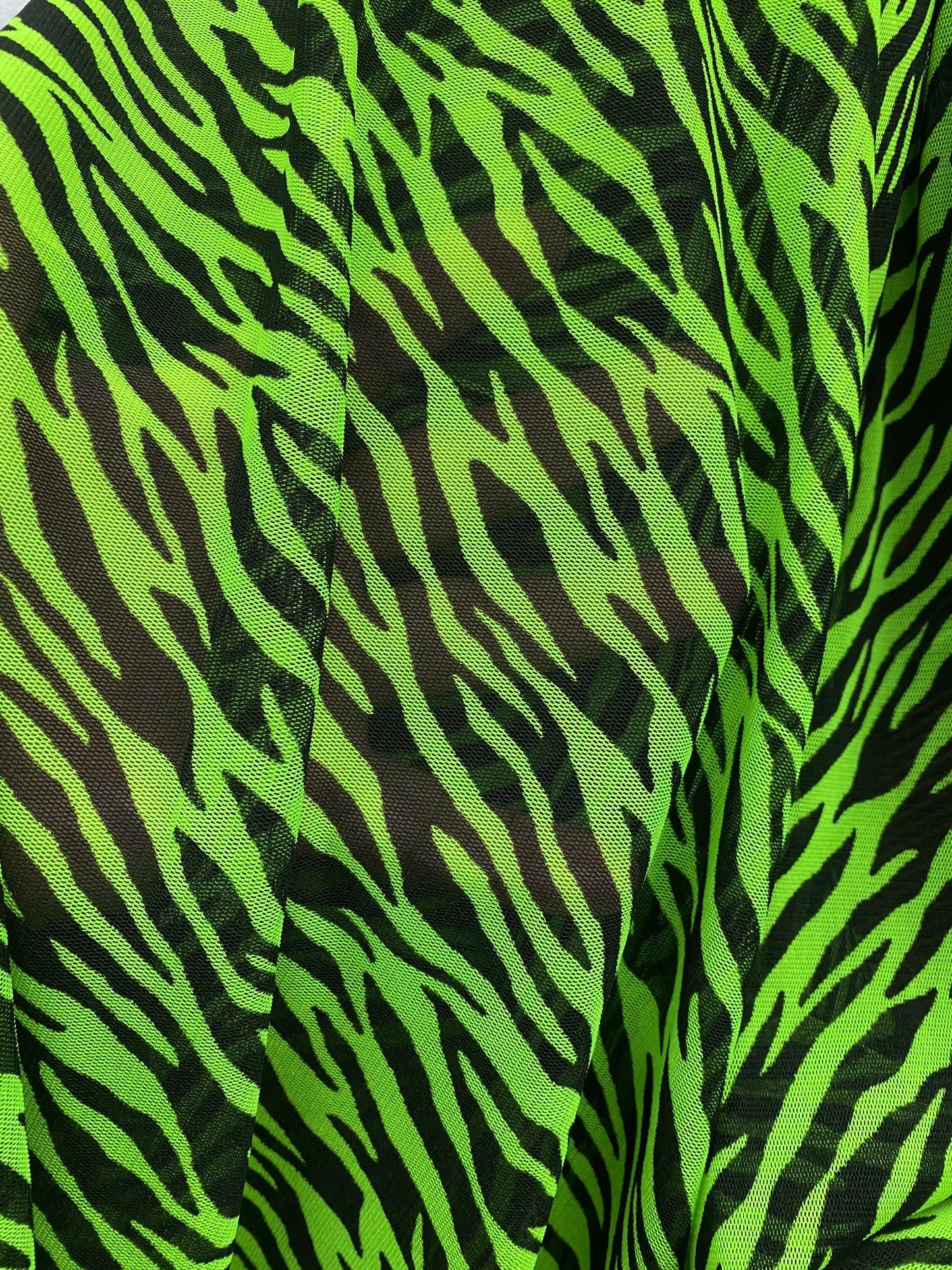 Exotic Zebra design Green/Black print on power mesh 4-way stretch 58/60” Sold by the YD. Ships Worldwide from Los Angeles California USA.