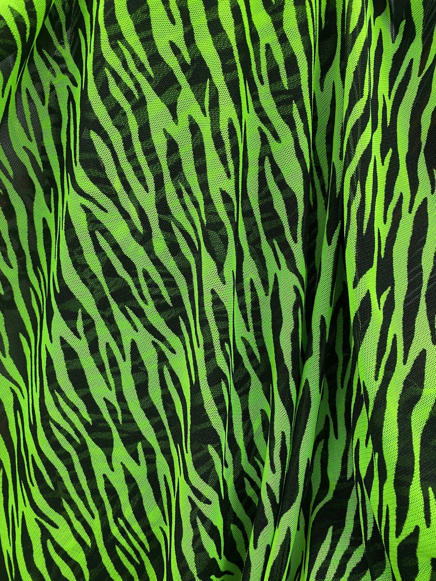 Exotic Zebra design Green/Black print on power mesh 4-way stretch 58/60” Sold by the YD. Ships Worldwide from Los Angeles California USA.