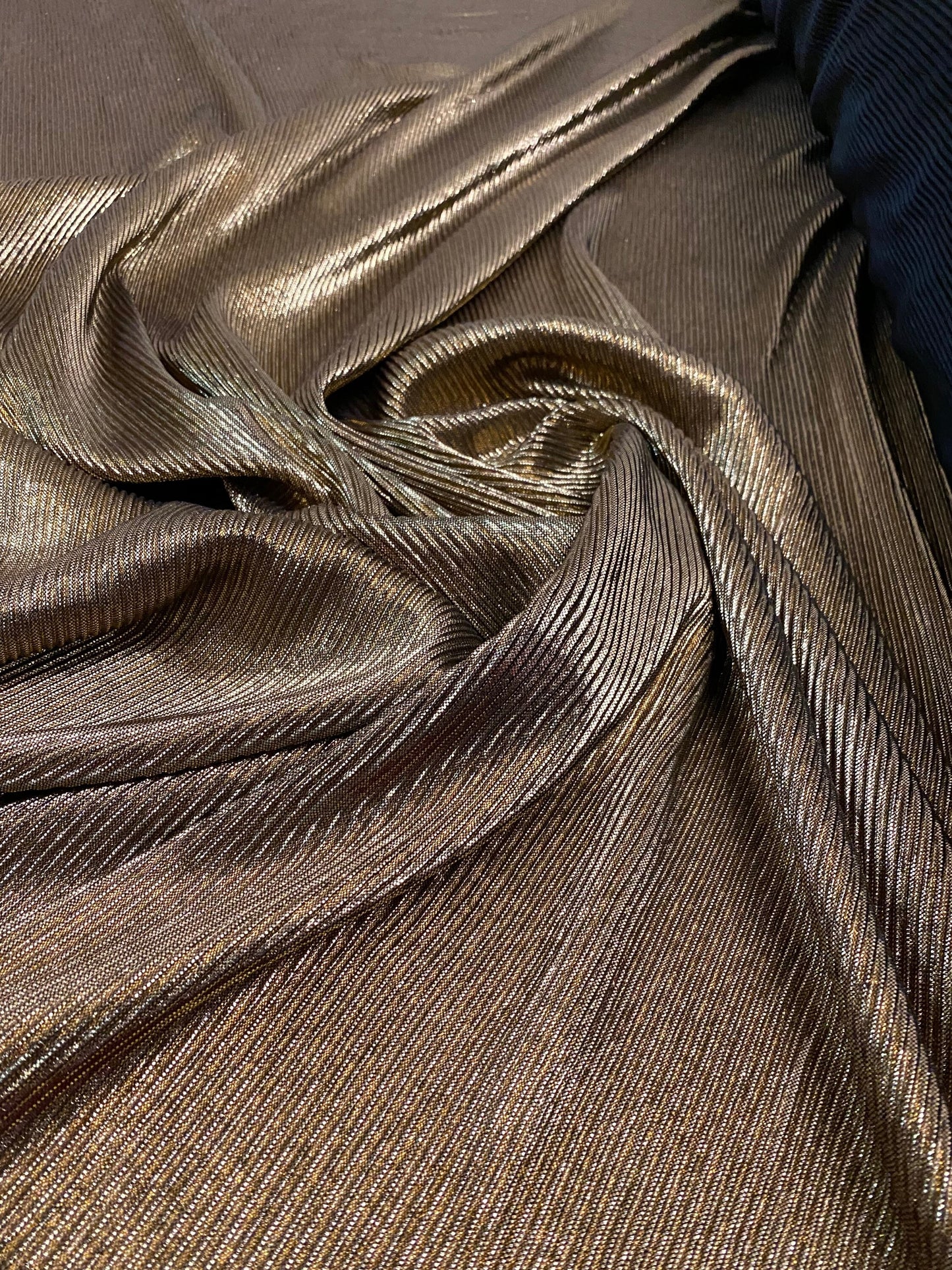 New accordion metallic pleated poly spandex black/gold 2-way Stretch 58/60” Sold by the YD. Ships Worldwide from Los Angeles California USA.