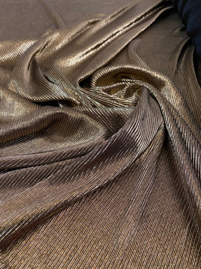 New accordion metallic pleated poly spandex black/gold 2-way Stretch 58/60” Sold by the YD. Ships Worldwide from Los Angeles California USA.