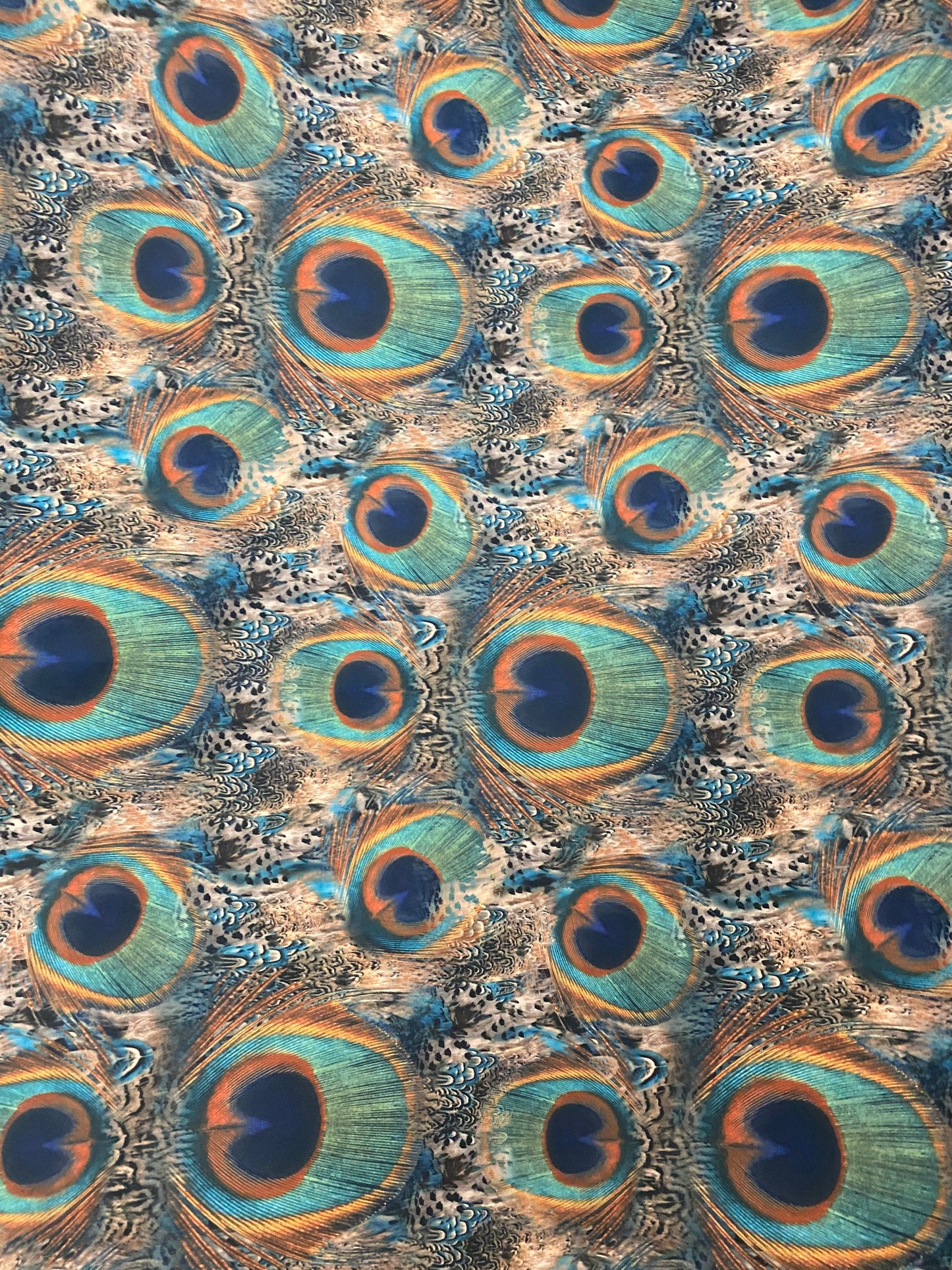 Peacock design print of great quality of nylon spandex 4-way stretch 58/60” Sold by the YD. Ships worldwide from Los Angeles California USA.