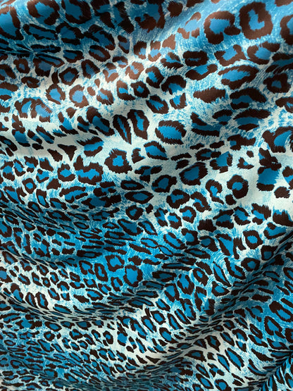 Exotic leopard design Teal/Blue/black print on nylon spandex 4-way stretch 58/60” Sold by the YD. Ships worldwide from Los Angeles Californi