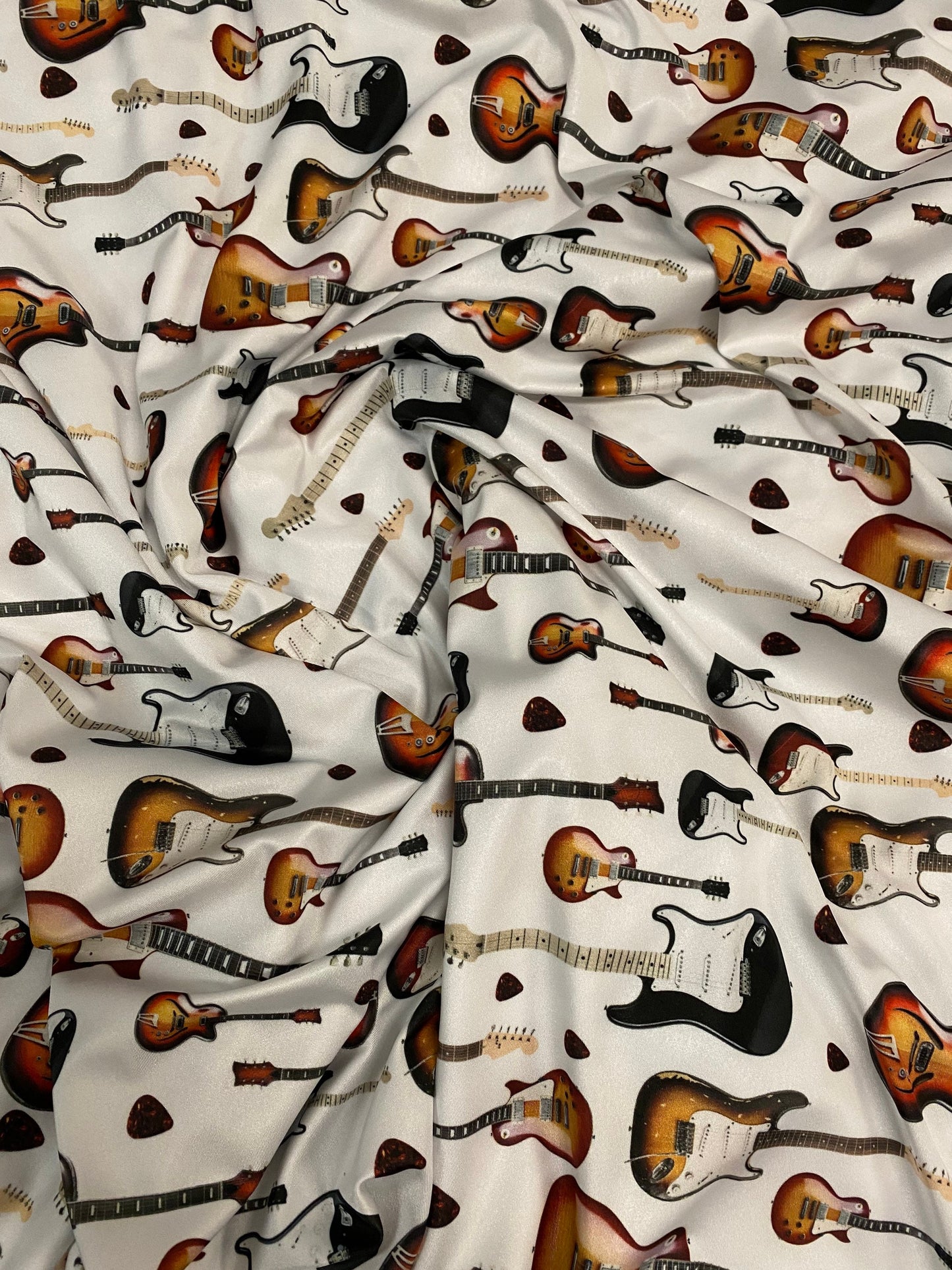 New Electric Guitar design print on great quality of nylon spandex 4-way stretch 58/60” Sold by the YD. Ships Worldwide from Los Angeles CA.