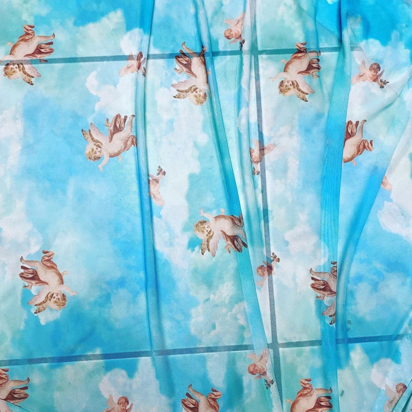 New Divine celestial Angels design Aqua blue color print on great quality of nylon power mesh 4-way stretch 58/60” Sold by the YD.