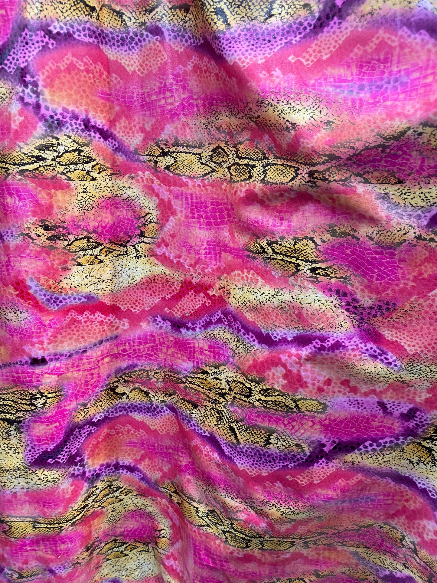 New Exotic snake design pink multicolor print on poly spandex multicolor with all over foil 2-way stretch 58/60” Sold by the YD.