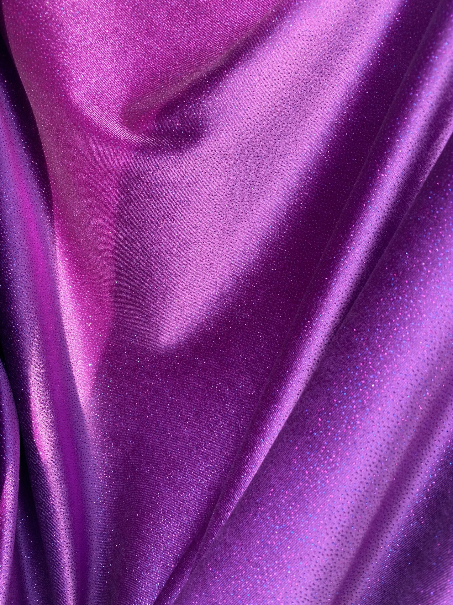 New Selena design eggplant purple stretch velvet with glitter all over medium weight 4-way stretch 58/60” Sold by the YD. Ships Worldwide