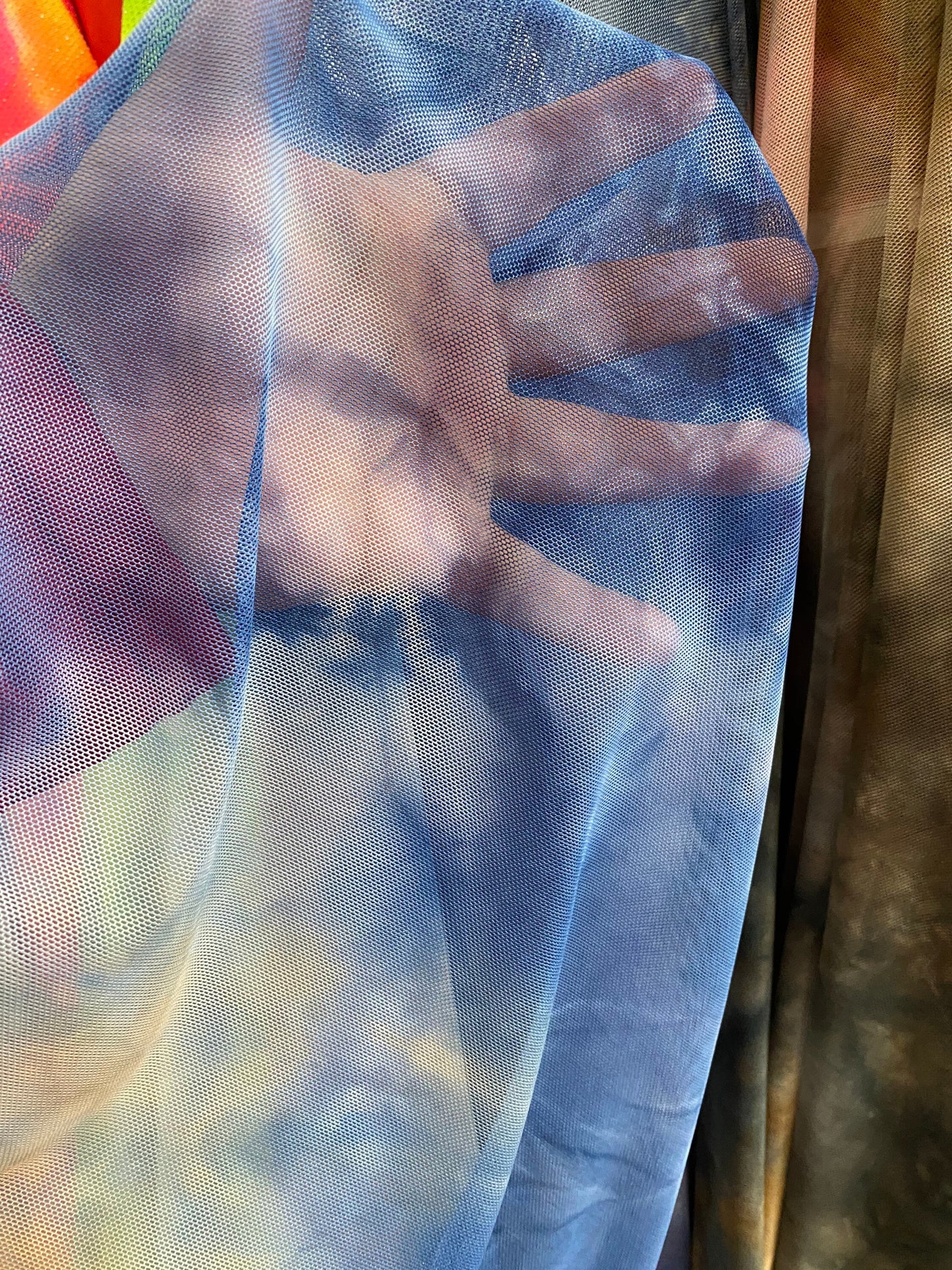 Tie dye power mesh multicolor 4-way stretch 58/60” Sold by the YD. Ships Worldwide from Los Angeles California USA.