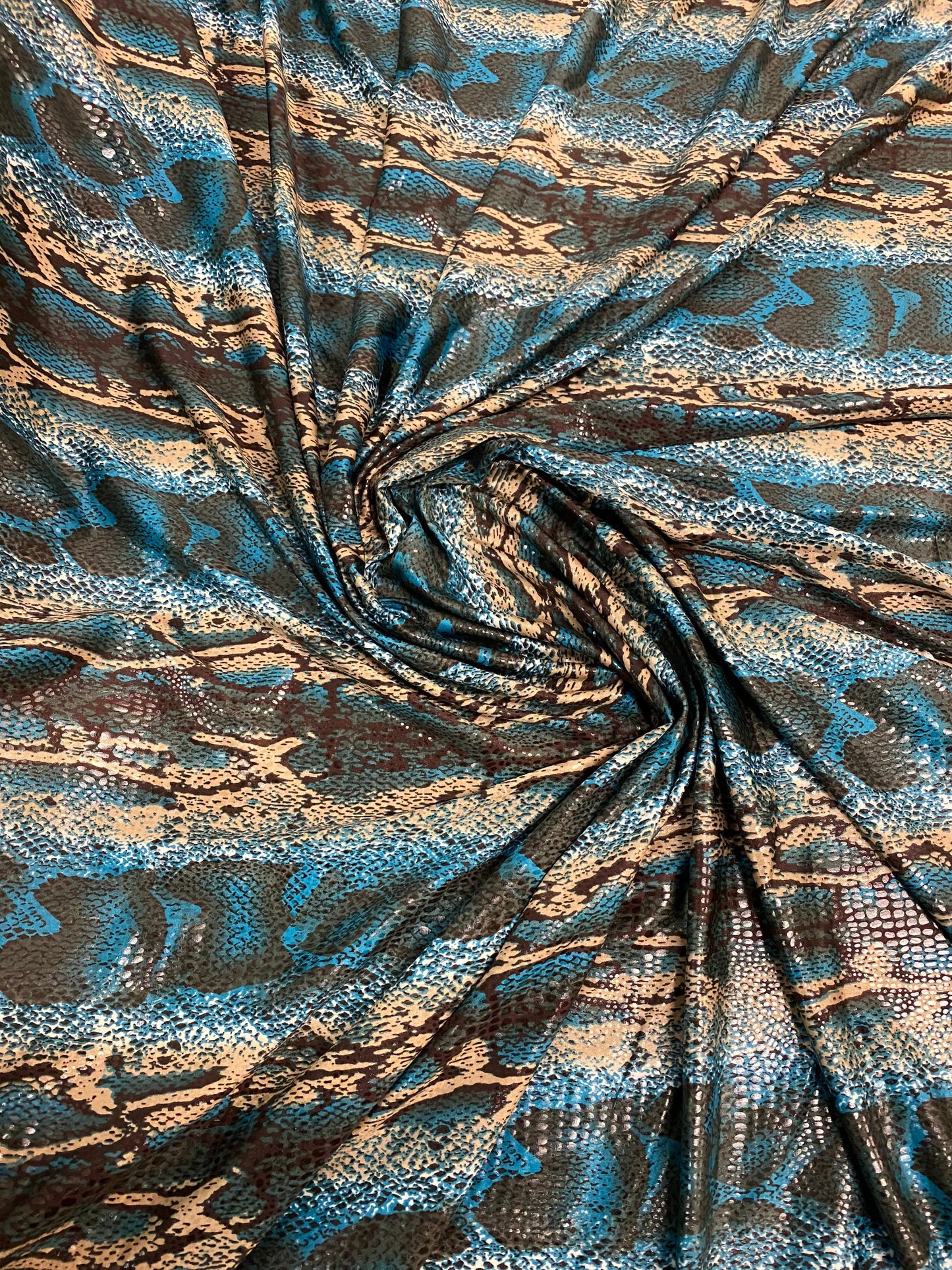 New Anaconda snake design print on poly spandex it’s clear foil medium weight 2-way stretch 58/60” Sold by the YD. Ships Worldwide