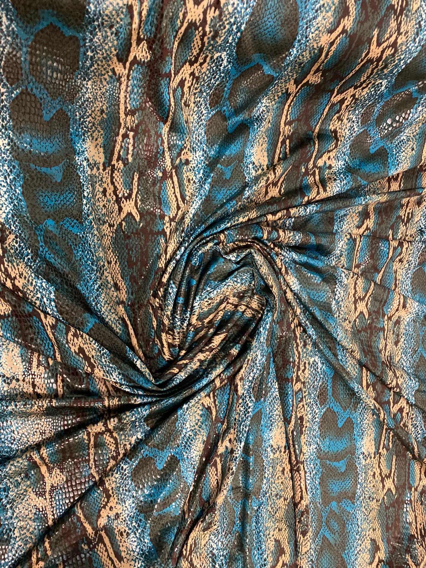 New Anaconda snake design print on poly spandex it’s clear foil medium weight 2-way stretch 58/60” Sold by the YD. Ships Worldwide