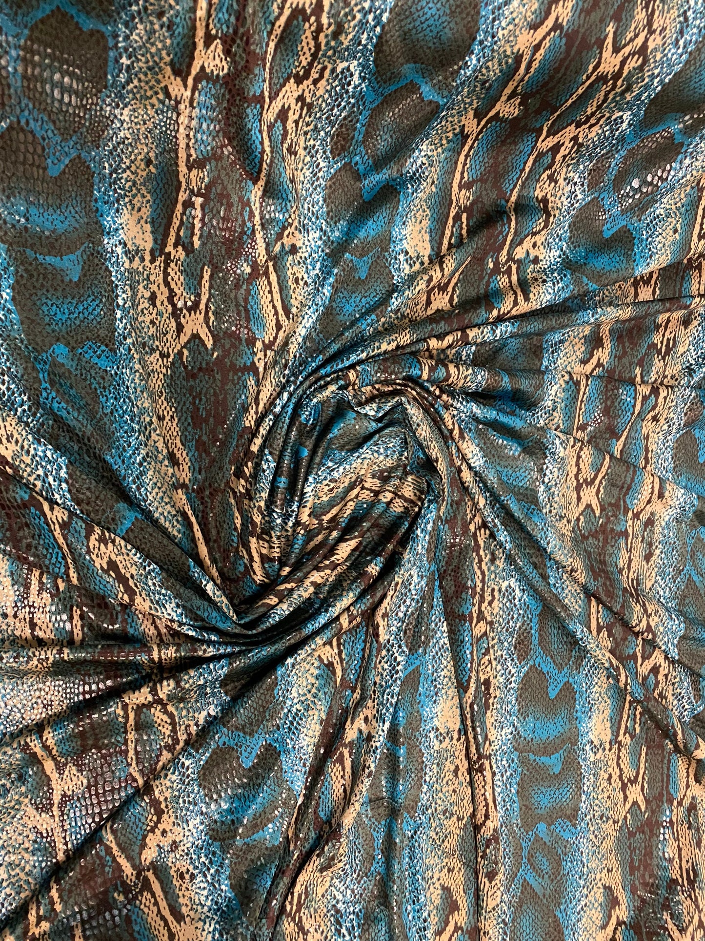 New Anaconda snake design print on poly spandex it’s clear foil medium weight 2-way stretch 58/60” Sold by the YD. Ships Worldwide