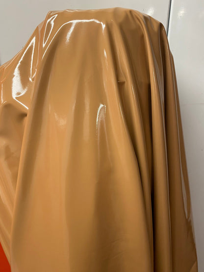 Shiny Latex Cappuccino color nylon spandex 4way stretch 58/60” Sold by the YD. Ships worldwide from Los Angeles California USA.