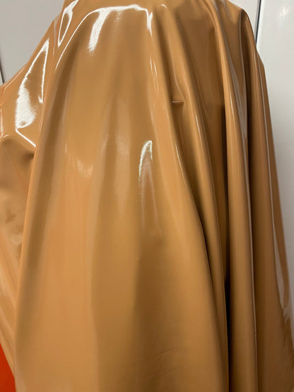 Shiny Latex Cappuccino color nylon spandex 4way stretch 58/60” Sold by the YD. Ships worldwide from Los Angeles California USA.