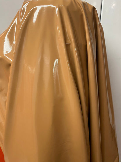 Shiny Latex Cappuccino color nylon spandex 4way stretch 58/60” Sold by the YD. Ships worldwide from Los Angeles California USA.