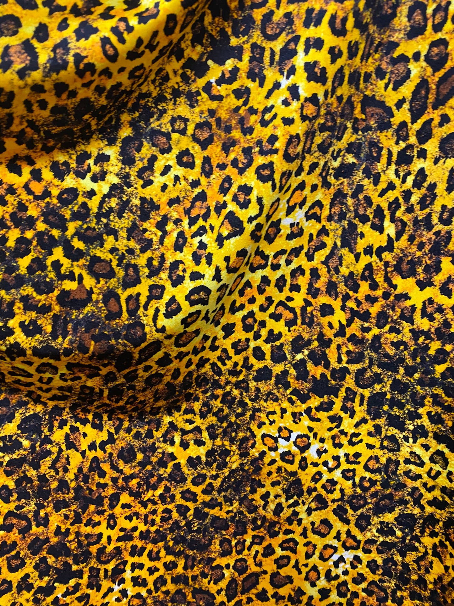 Exotic Leopard design gold/brown/Black print on best quality of nylon spandex 4-way stretch 58/60” Sold by the YD. Ships Worldwide