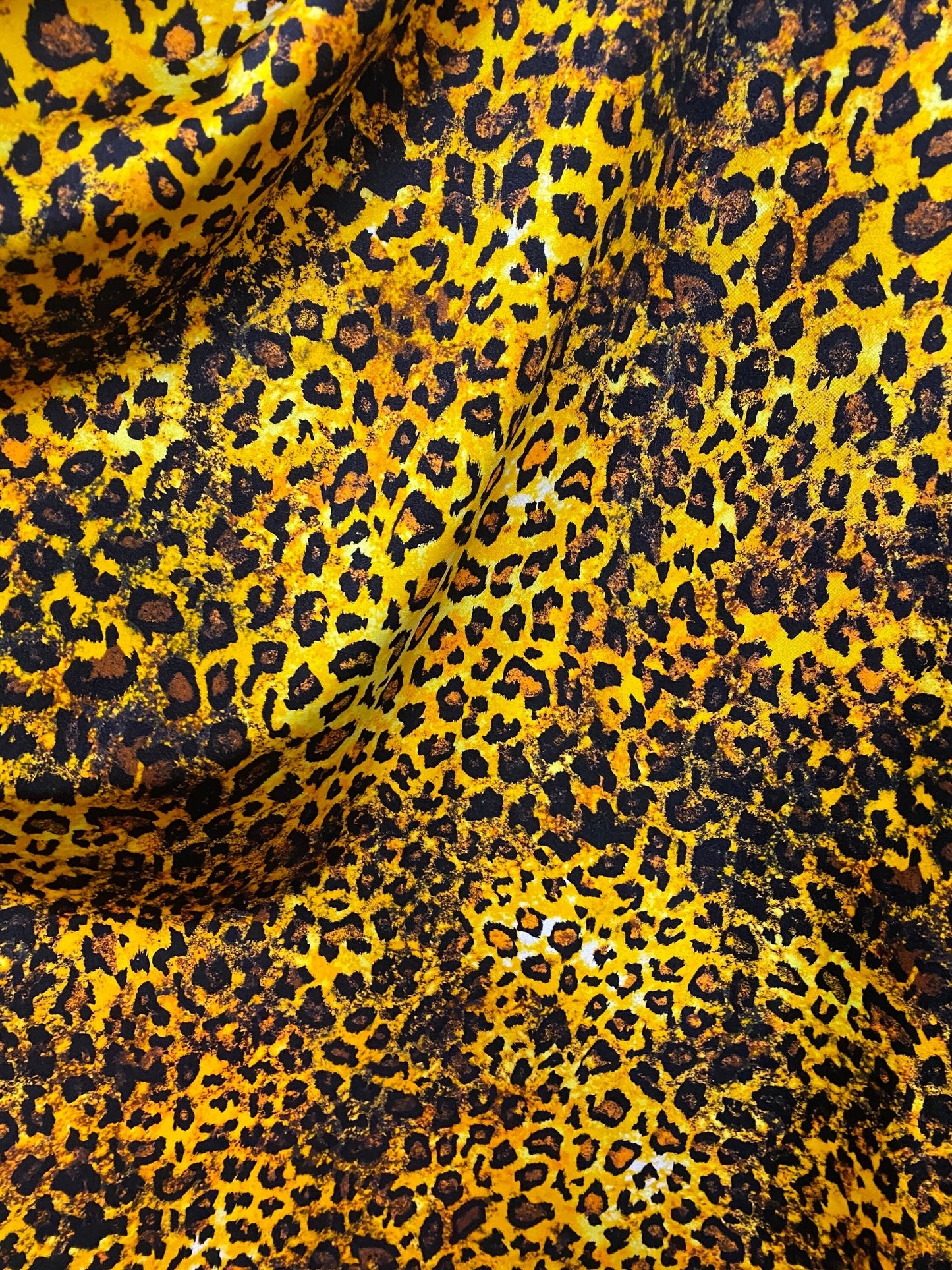 Exotic Leopard design gold/brown/Black print on best quality of nylon spandex 4-way stretch 58/60” Sold by the YD. Ships Worldwide