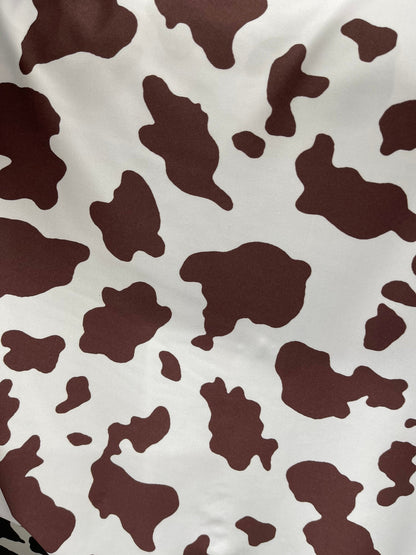 Cow design white/brown print on great quality of nylon spandex 4-way stretch 58/60” Sold by the YD. Ships Worldwide from Los Angeles Califor