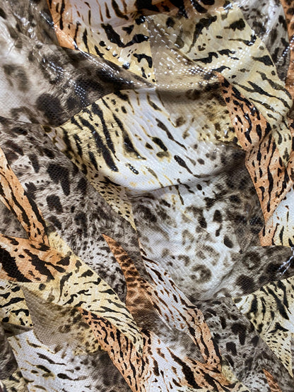 New Exotic multi animal print Taupe multicolor with clear foil print on poly spandex 2-way stretch 58-60” Sold by the YD. Ships Worldwide