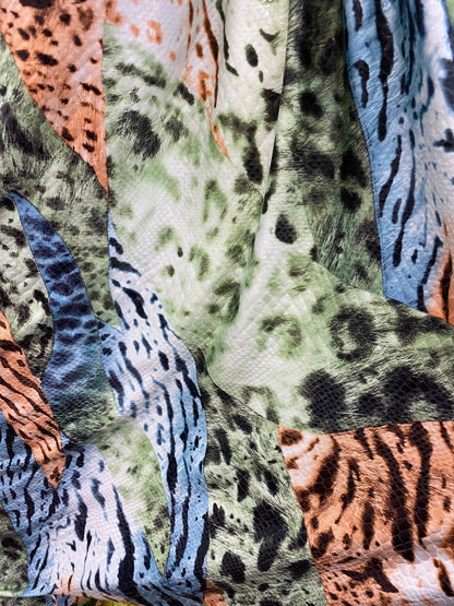 New Exotic multi animal print multicolor with clear foil print on poly spandex 2-way stretch 58-60” Sold by the YD. Ships Worldwide