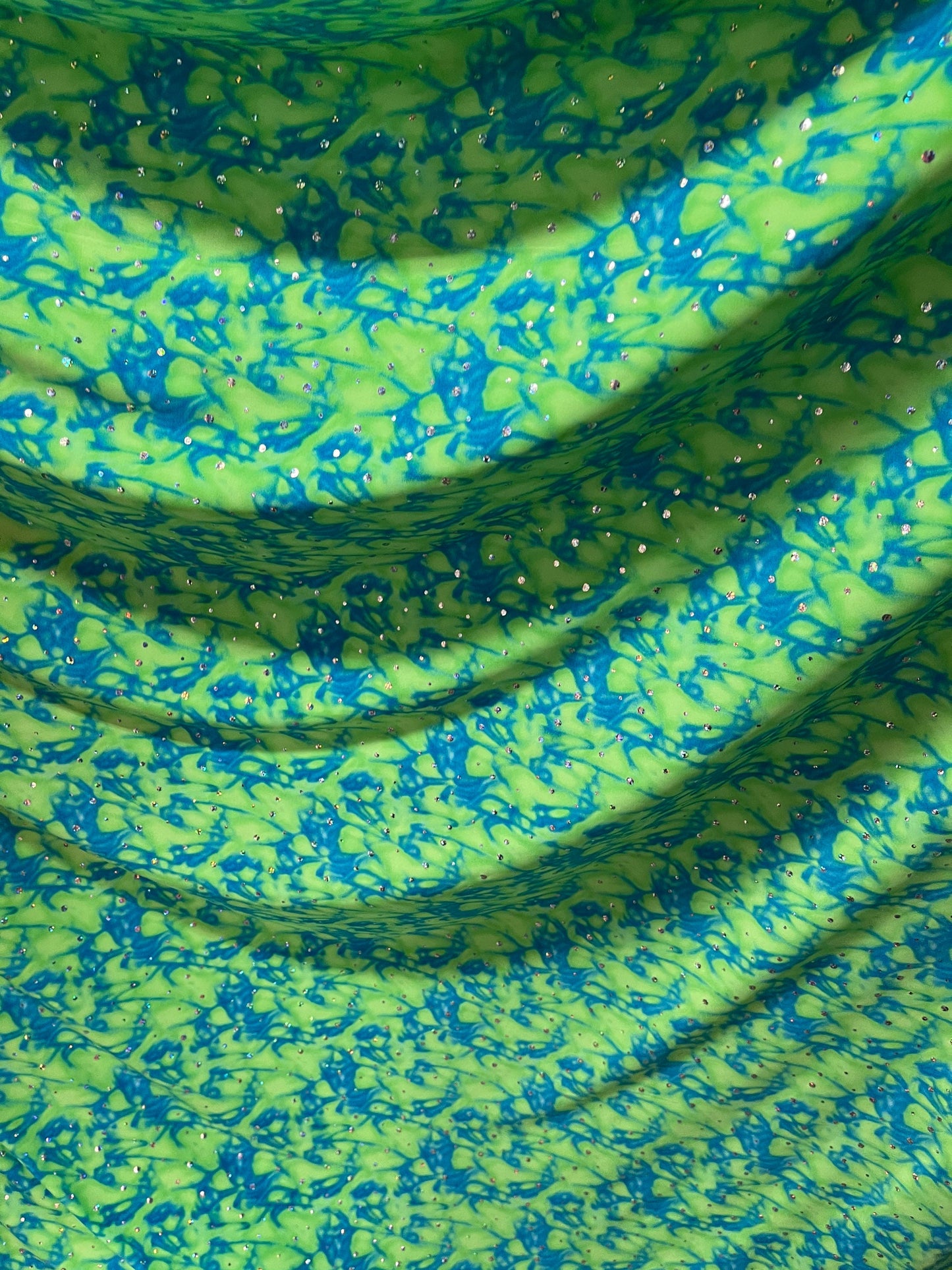 Water design Blue/green & Pink/yellow color print nylon spandex with hologram sequins 4-way stretch 58/60” Sold by the YD.