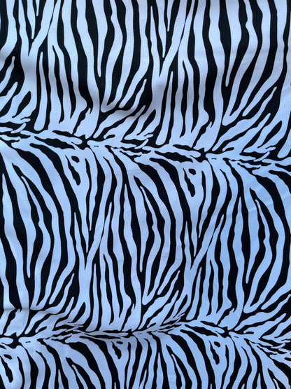 New Exotic zebra design medium size print on best quality of nylon spandex 4-way stretch 58/60” Sold by the YD. Ships Worldwide from L.A CA.