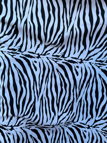 New Exotic zebra design medium size print on best quality of nylon spandex 4-way stretch 58/60” Sold by the YD. Ships Worldwide from L.A CA.