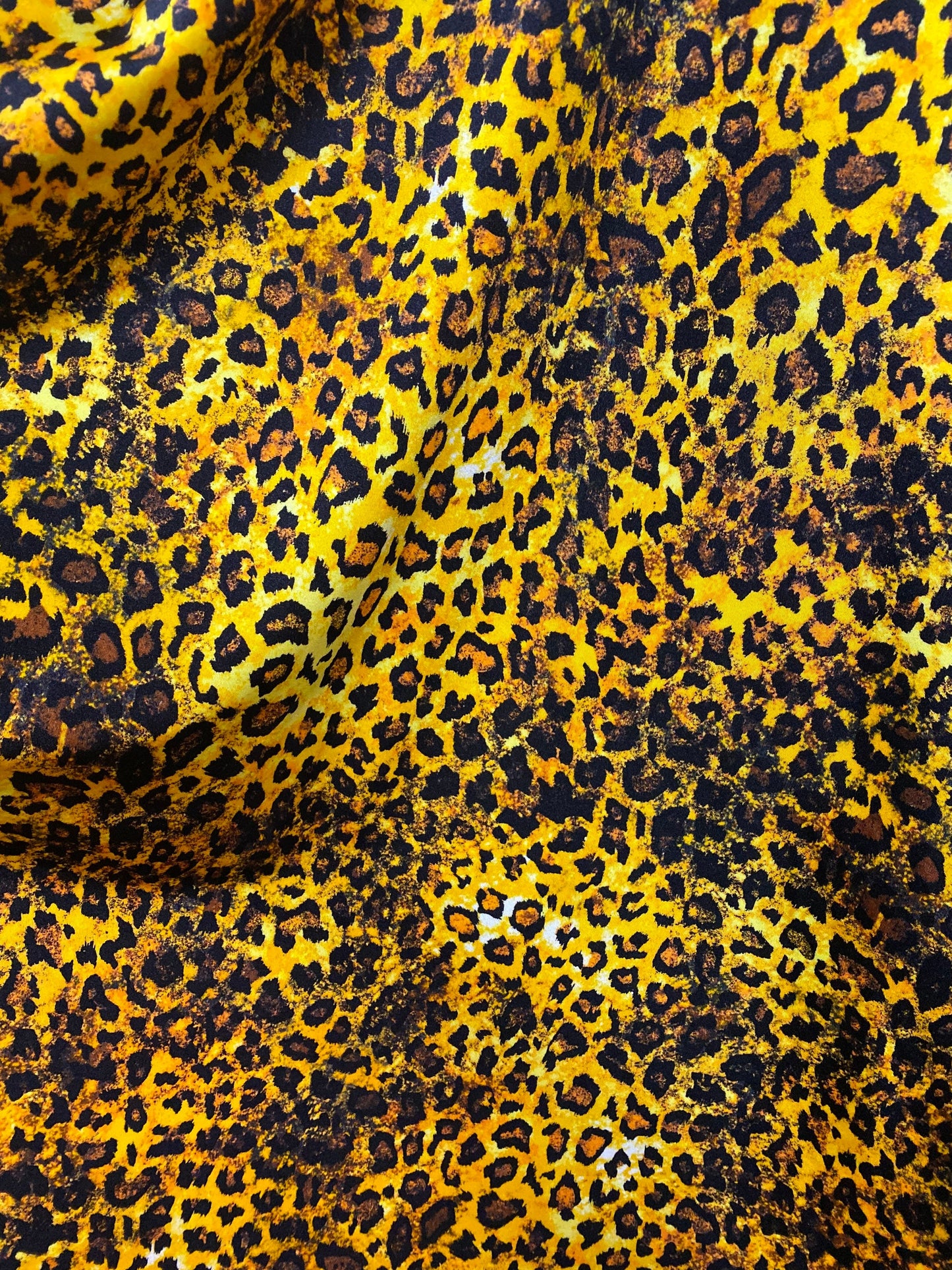 Exotic Leopard design gold/brown/Black print on best quality of nylon spandex 4-way stretch 58/60” Sold by the YD. Ships Worldwide