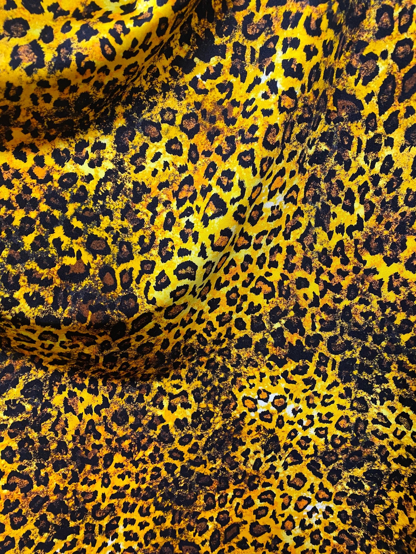 Exotic Leopard design gold/brown/Black print on best quality of nylon spandex 4-way stretch 58/60” Sold by the YD. Ships Worldwide