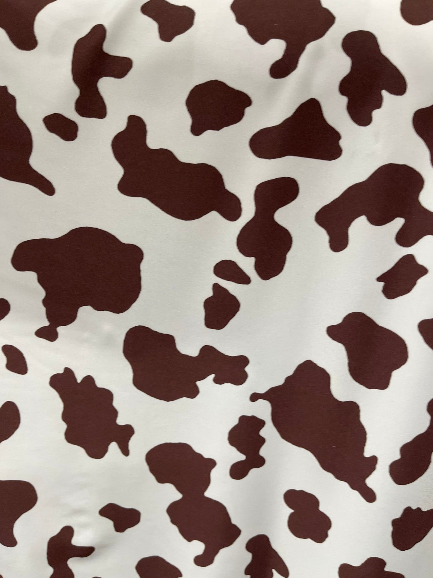 Cow design white/brown print on great quality of nylon spandex 4-way stretch 58/60” Sold by the YD. Ships Worldwide from Los Angeles Califor