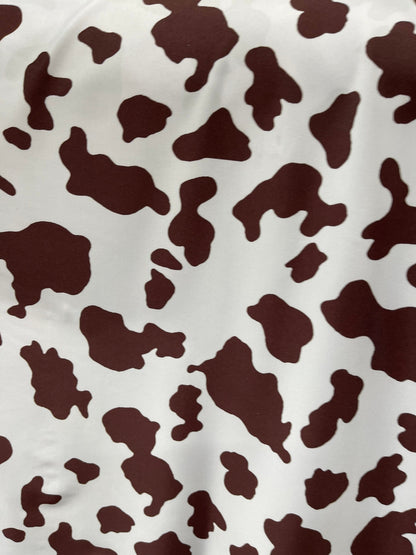 Cow design white/brown print on great quality of nylon spandex 4-way stretch 58/60” Sold by the YD. Ships Worldwide from Los Angeles Califor