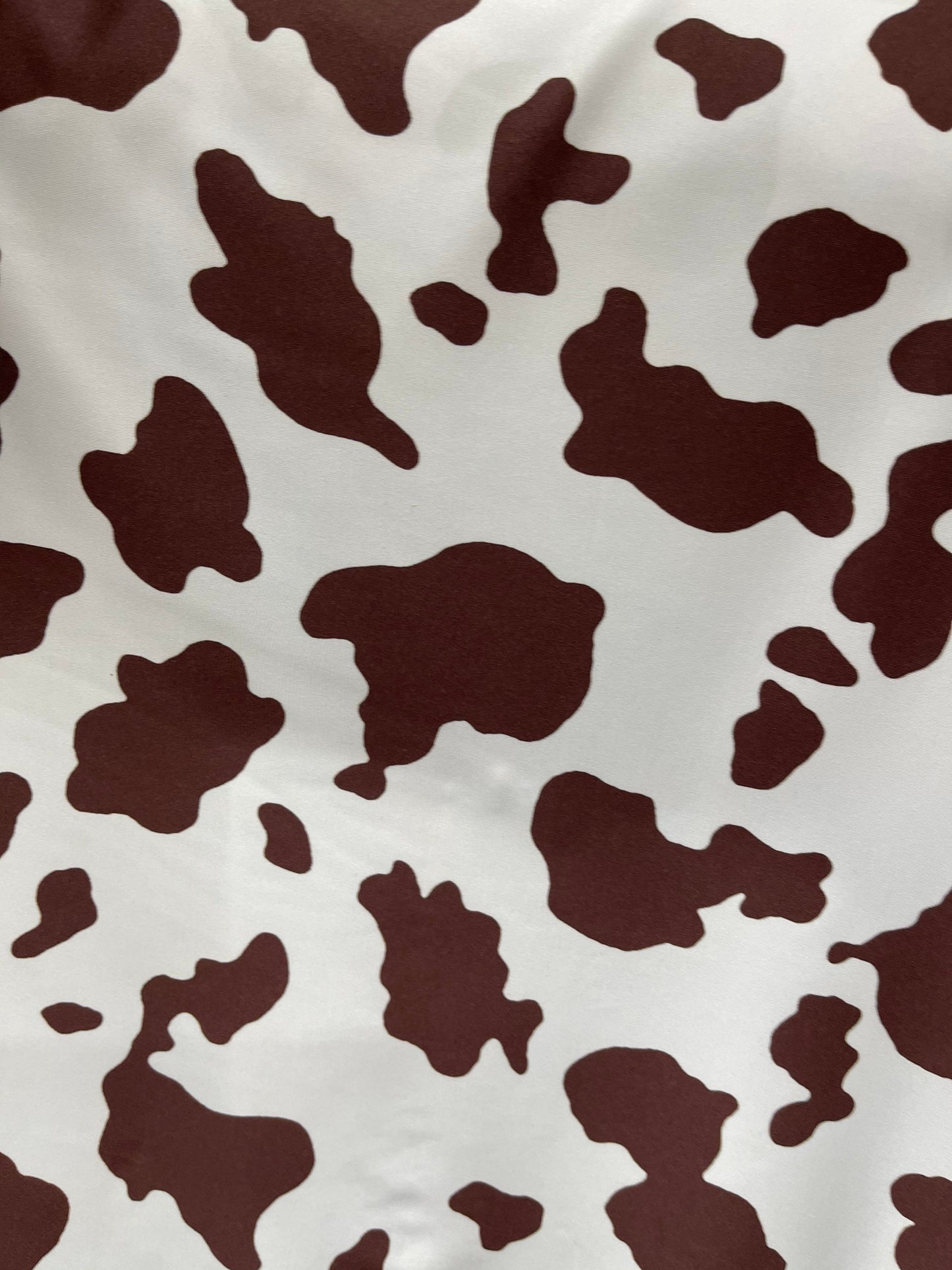 Cow design white/brown print on great quality of nylon spandex 4-way stretch 58/60” Sold by the YD. Ships Worldwide from Los Angeles Califor