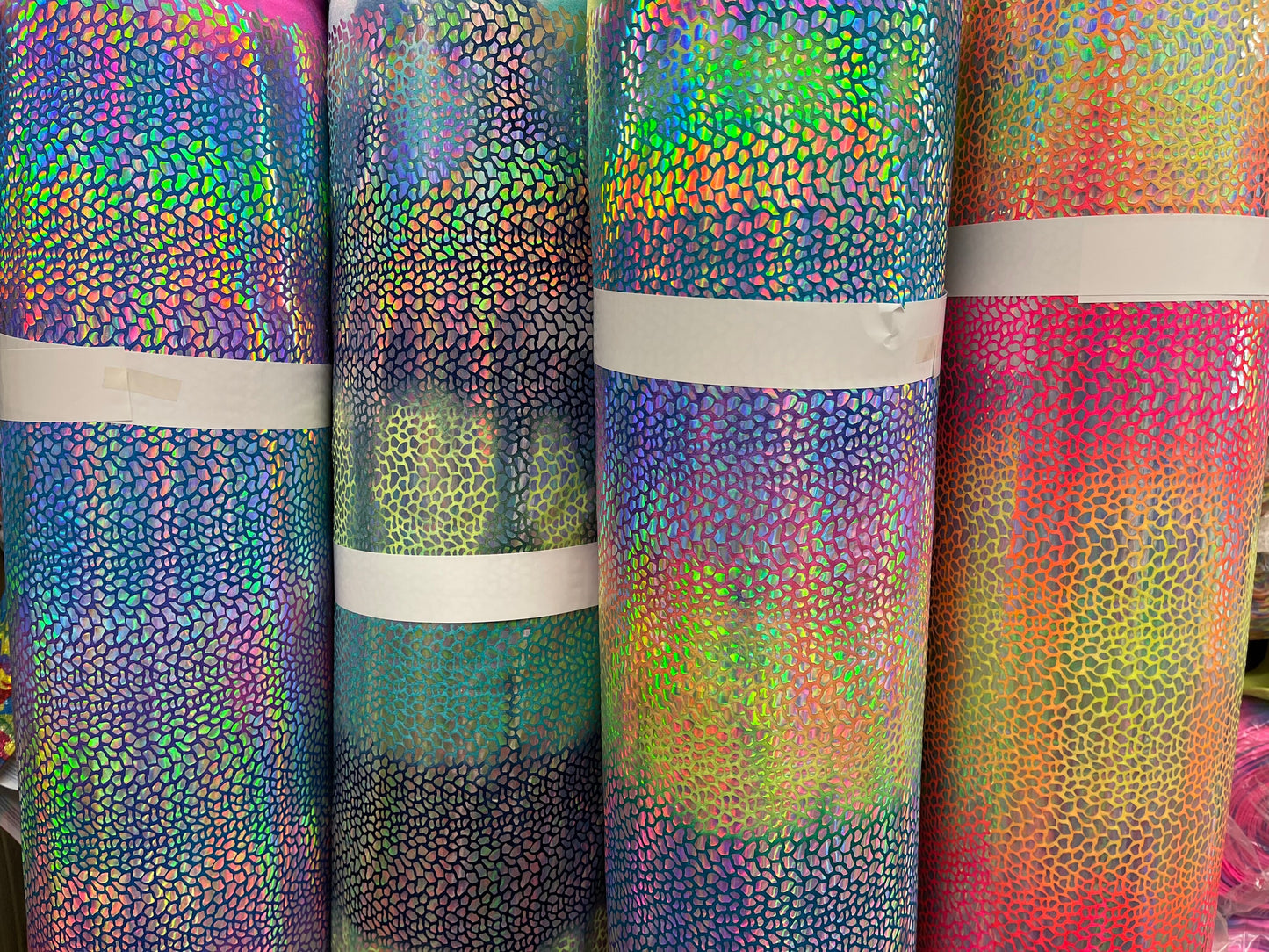 Tie Dye Dragón scales design Iridescent hologram sequins on best quality of nylon spandex 4-way stretch 58/60” Sold by the YD.