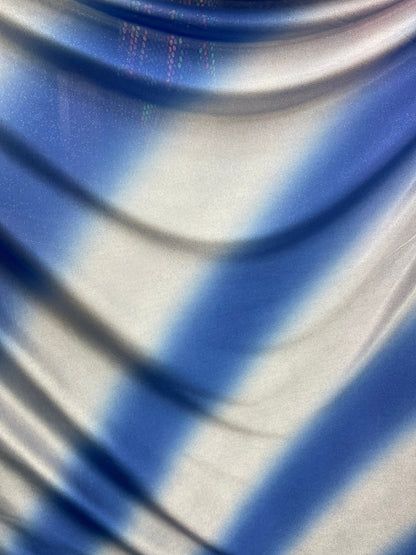 Tie dye diagonal design Sapphire/silver poliéster fabric with glitter  2-way stretch 58/60” Sold by the YD. Ships worldwide