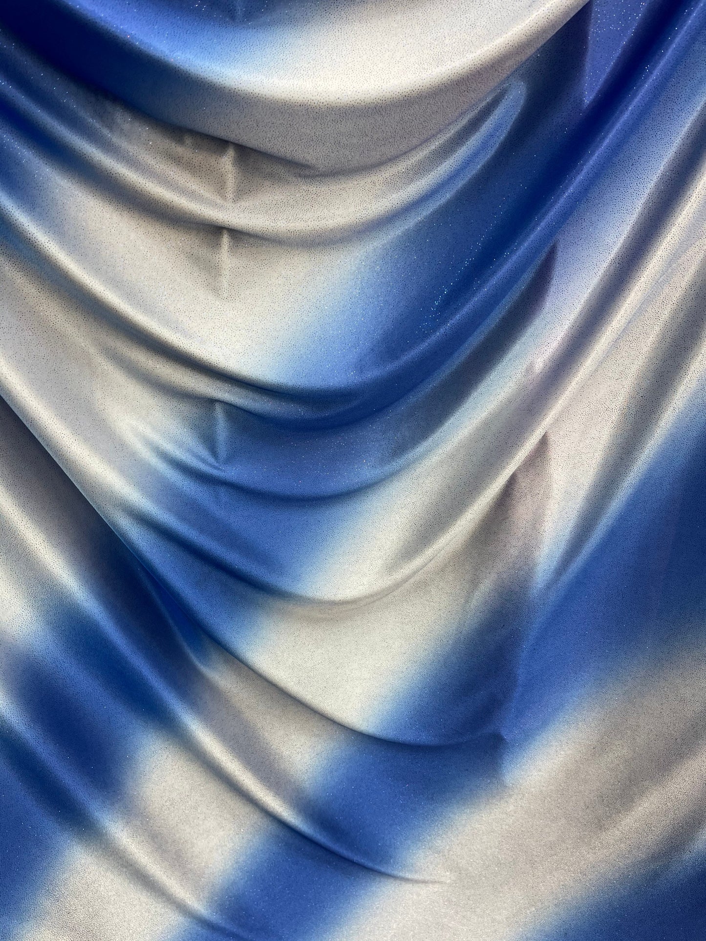 Tie dye diagonal design Sapphire/silver poliéster fabric with glitter  2-way stretch 58/60” Sold by the YD. Ships worldwide