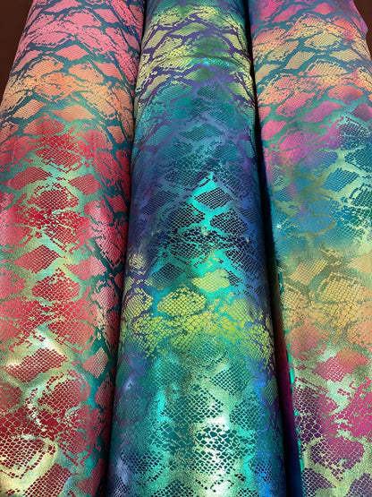 Exotic King snake design tie dye metallic nylon spandex with iridescent foil 4-way stretch 58/60” Sold by the YD. Ships worldwide