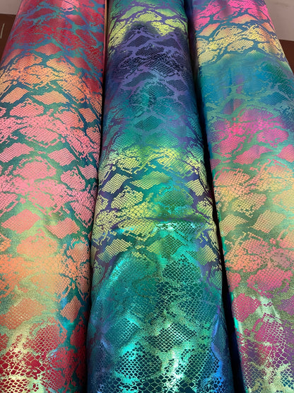 Exotic King snake design tie dye metallic nylon spandex with iridescent foil 4-way stretch 58/60” Sold by the YD. Ships worldwide