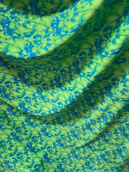 Water design Blue/green & Pink/yellow color print nylon spandex with hologram sequins 4-way stretch 58/60” Sold by the YD.