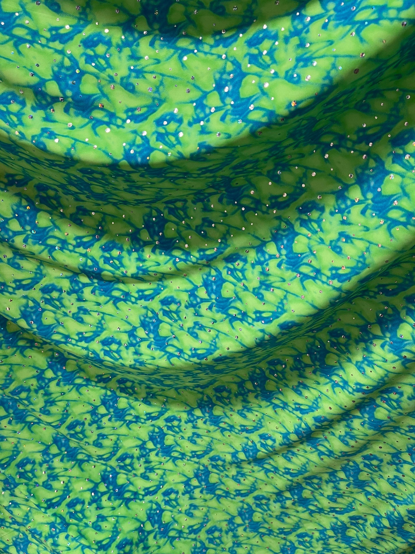 Water design Blue/green & Pink/yellow color print nylon spandex with hologram sequins 4-way stretch 58/60” Sold by the YD.