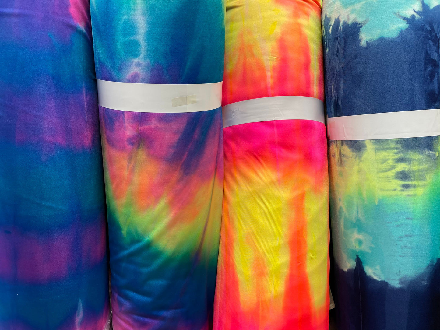 Tie dye Luxury shiny nylon spandex 4-way stretch 58/60” Sold by the YD. Ships Worldwide from Los Angeles California USA.