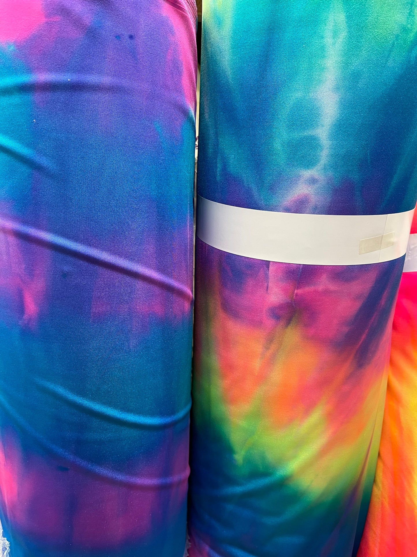 Tie dye Luxury shiny nylon spandex 4-way stretch 58/60” Sold by the YD. Ships Worldwide from Los Angeles California USA.