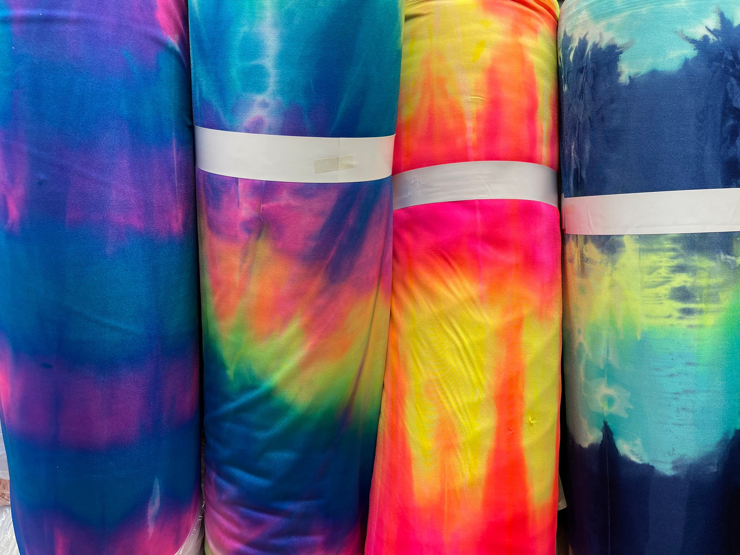 Tie dye Luxury shiny nylon spandex 4-way stretch 58/60” Sold by the YD. Ships Worldwide from Los Angeles California USA.