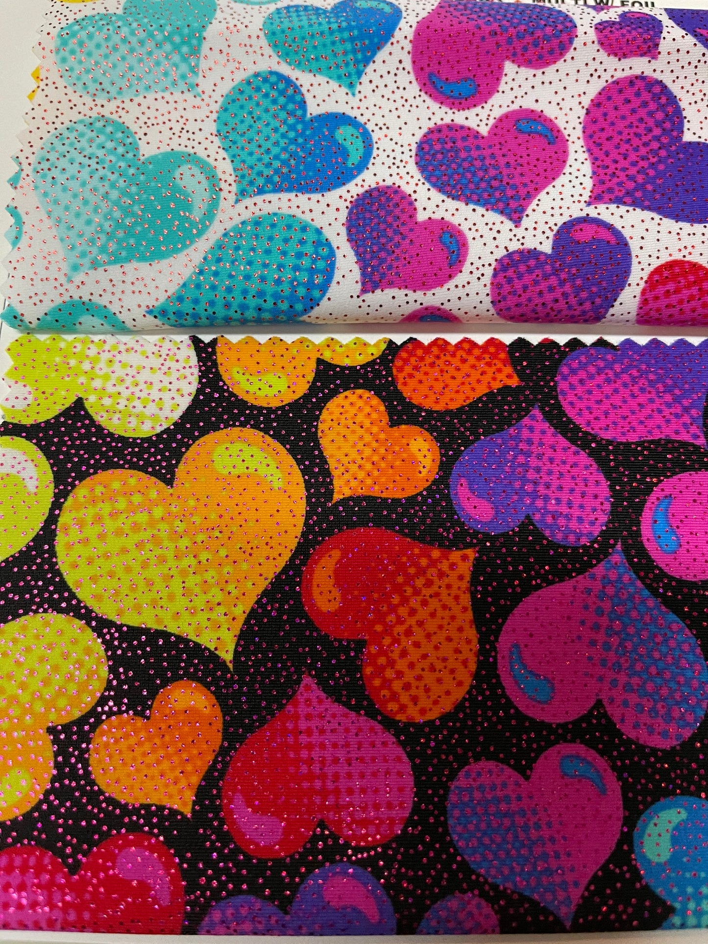 Multi heart design print on nylon spandex with foil 4way Stretch 58/60” Sold by the yd. Ships worldwide from Los Angeles California USA