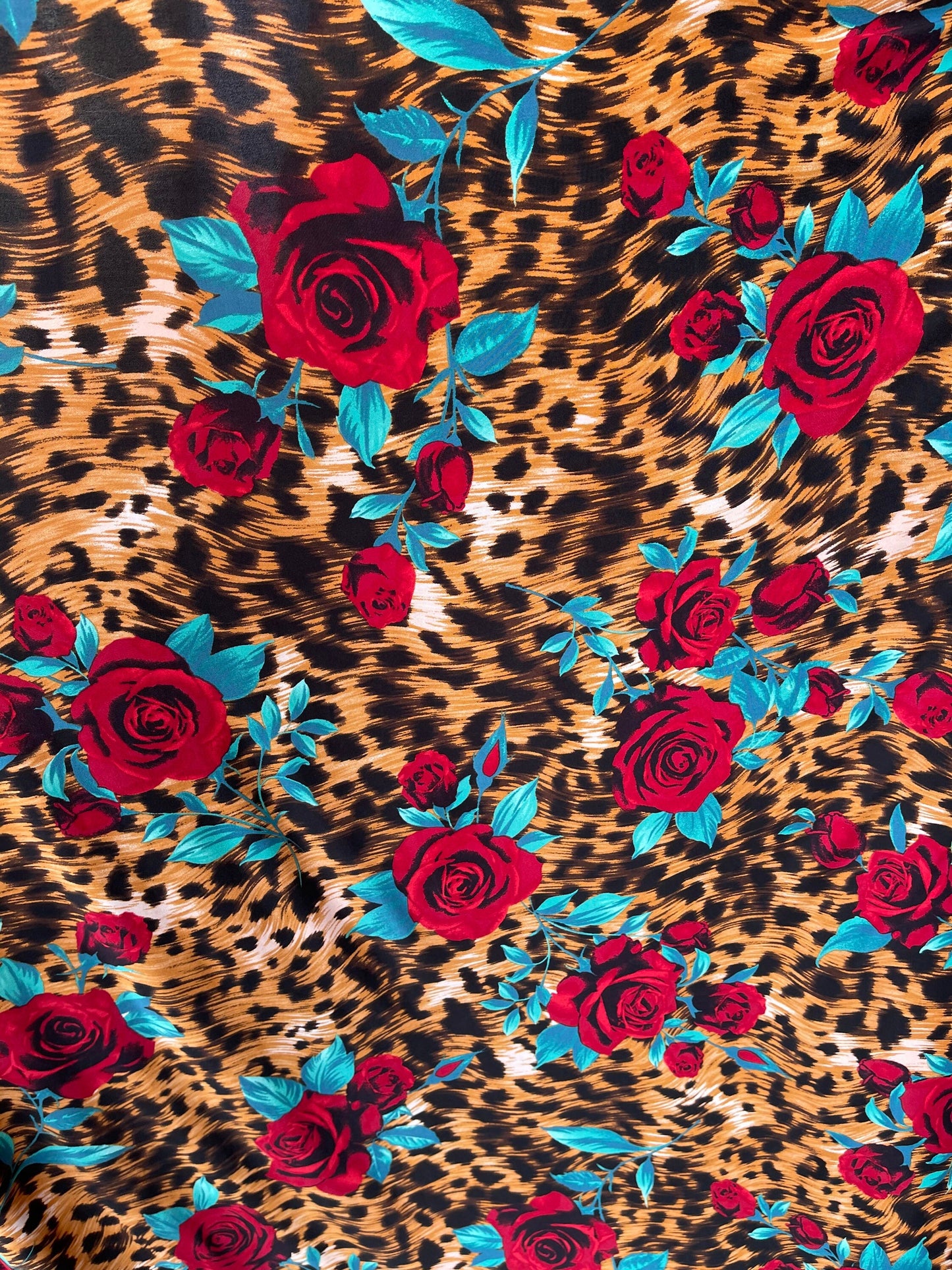 New Exotic animal print design with red flower print on poly spandex 4-way stretch 58/60” Sold by the YD. Ships Worldwide from Los Angeles