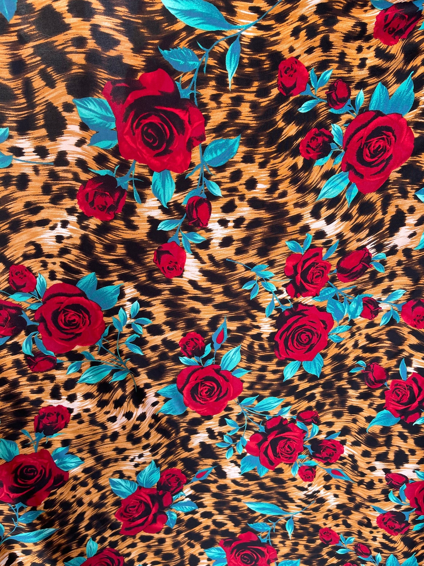 New Exotic animal print design with red flower print on poly spandex 4-way stretch 58/60” Sold by the YD. Ships Worldwide from Los Angeles