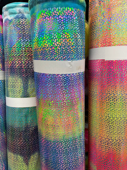 Tie Dye Dragón scales design Iridescent hologram sequins on best quality of nylon spandex 4-way stretch 58/60” Sold by the YD.