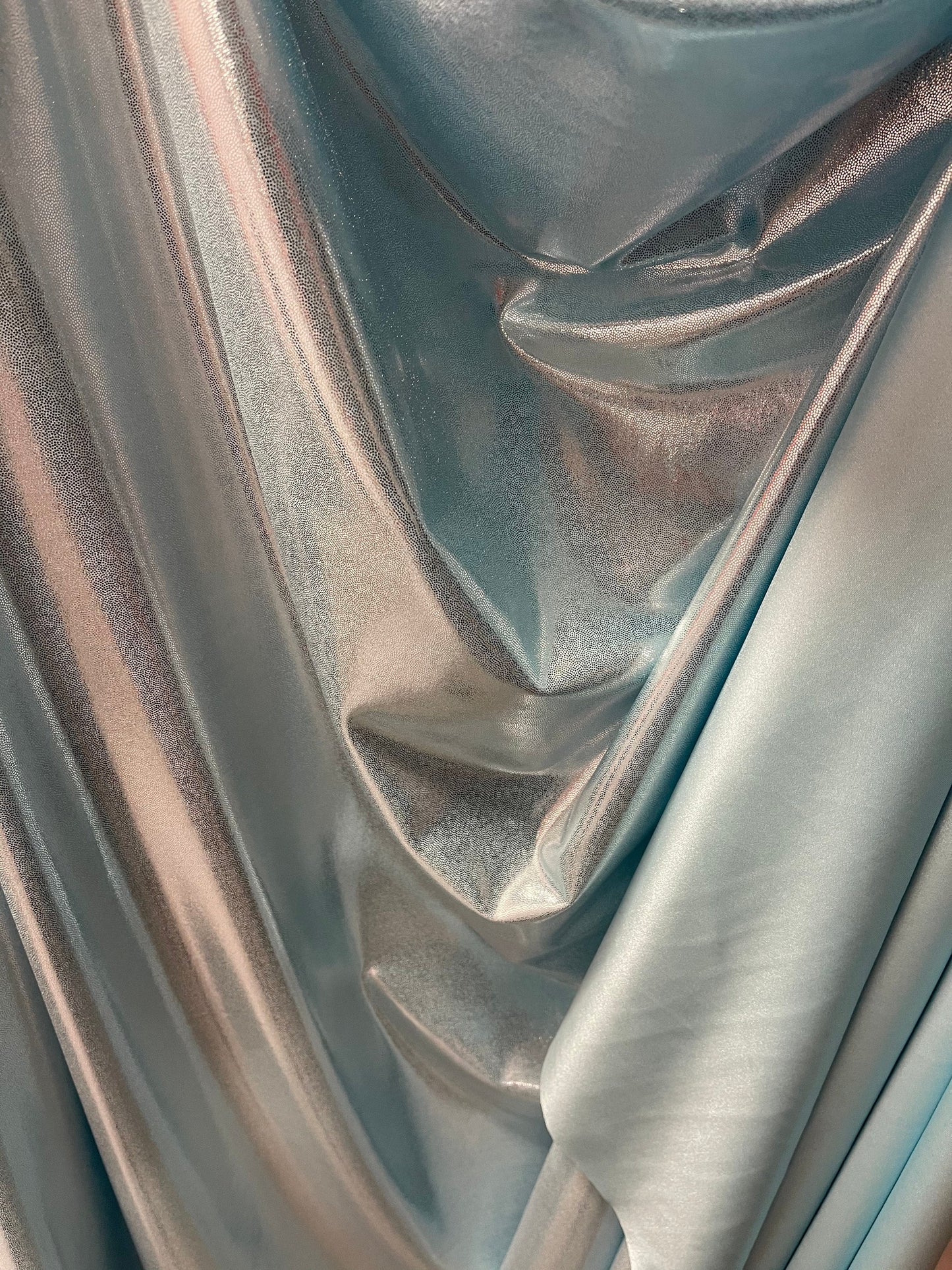 Lt blue metallic nylon spandex with foggy foil 4-way stretch 58/60” Sold by the YD. Ships Worldwide from Los Angeles California USA