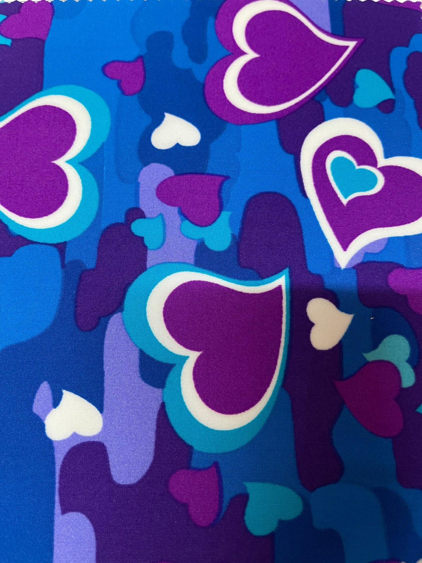 New camouflage with hearts design magenta multicolor print on best quality of nylon spandex 4-way stretch 58/60” Sold by the YD.